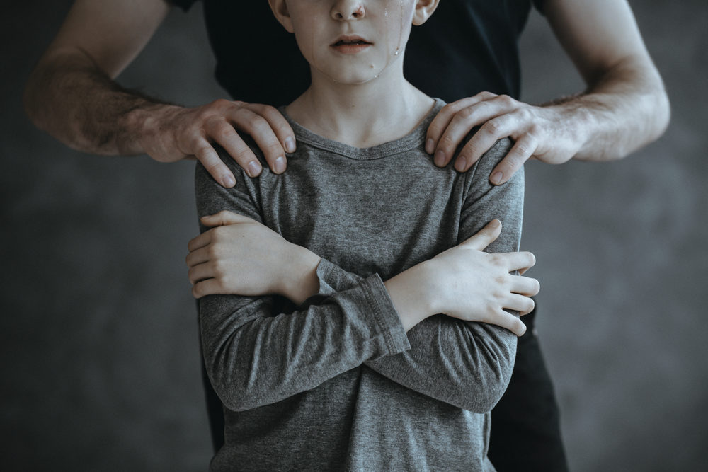 Supportive imagery showing hands in a protective gesture